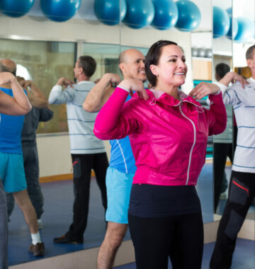 Group of adults doing aerobics exercise in sport club Group of adults doing aerobics exercise in sport club