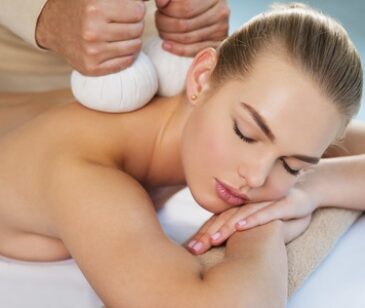 Woman getting  massage with hot stones